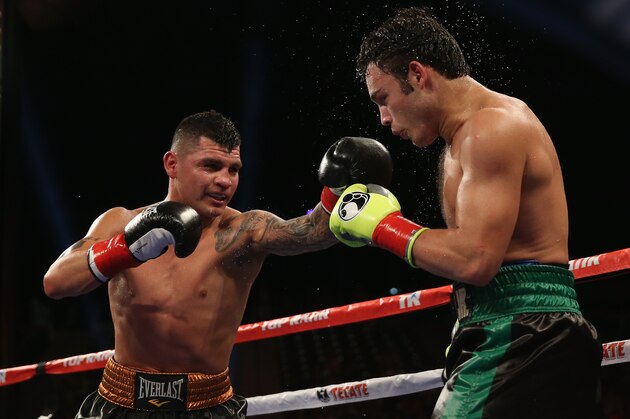 LOS ANGELES, CA - SEPTEMBER 28:  Brian Vera (L) lands a left hand to the head of Julio Cesar Chavez Jr. during their Light Heavyweight bout at StubHub Center on September 28, 2013 in Los Angeles, California.  (Photo by Jeff Gross/Getty Images)