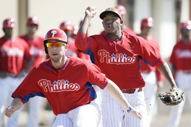 Philadelphia Phillies Maikel Franco, right, chases teammate Clete Thomas during a drill in a spring training baseball practice Wednesday, Feb. 19, 2014, in Clearwater, Fla. (AP Photo/Charlie Neibergall) Philadelphia Phillies Maikel Franco, right, chases teammate Clete Thomas during a drill in a spring training baseball practice Wednesday, Feb. 19, 2014, in Clearwater, Fla. (AP Photo/Charlie Neibergall)