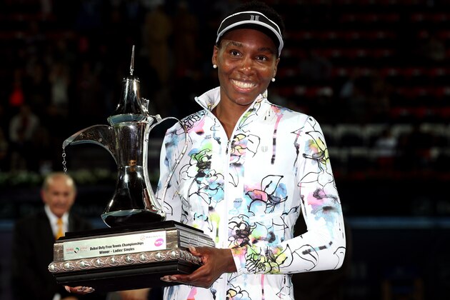 DUBAI, UNITED ARAB EMIRATES - FEBRUARY 22:  Venus Williams of the USA poses with the trophy after beating Alize Cornet of France in the final of the WTA Dubai Dury Free Tennis Championship at the Dubai Tennis Stadium on February 22, 2014 in Dubai, United Arab Emirates.  (Photo by Warren Little/Getty Images)