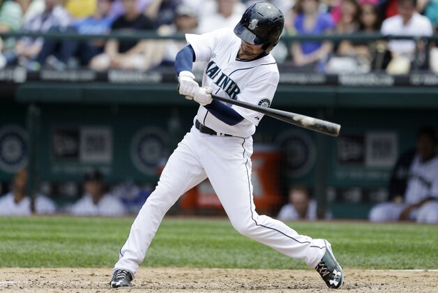 Seattle Mariners' Nick Franklin homers against the Minnesota Twins in the fourth inning of a baseball game Sunday, July 28, 2013, in Seattle. (AP Photo/Elaine Thompson)