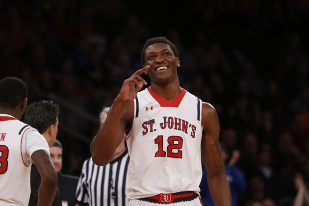 St. John's Chris Obekpa (12), of Nigeria, reacts during the second half of an NCAA college basketball game against Creighton Sunday, Feb. 9, 2014, in New York.  St. John's won 70-65. (AP Photo/Jason DeCrow)