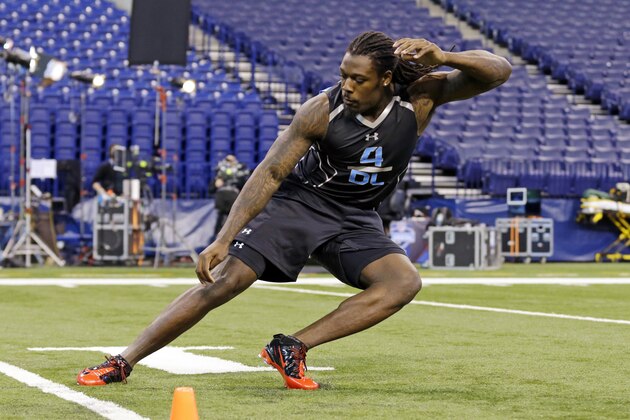 South Carolina defensive lineman Jadeveon Clowney runs a drill at the NFL football scouting combine in Indianapolis, Monday, Feb. 24, 2014. (AP Photo/Michael Conroy)