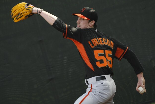 Feb 16, 2014; Scottsdale, AZ, USA; San Francisco Giants starting pitcher Tim Lincecum (55) throws in the bullpen during camp at Scottsdale Stadium. Mandatory Credit: Rick Scuteri-USA TODAY Sports
