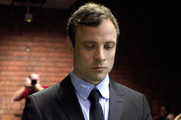 FILE In this file photo taken Monday, Aug. 19, 2013 double-amputee Olympian Oscar Pistorius, at the magistrates court in Pretoria, South Africa, when Pistorius was indicted on charges of murder and illegal possession of ammunition for the shooting death of his girlfriend on Valentine's Day. It was reported on Thursday, Jan. 23, 2014, that Oscar Pistorius' lawyers have been negotiating an out-of court settlement for nearly six months with representatives of the parents of slain girlfriend Reeva Steenkamp, which a legal expert says could be raised by prosecutors in the Olympic athlete's murder trial.  Lawyers for both sides said Thursday the negotiations are continuing and declined to comment on any details of a possible settlement, which media reports say could see the double-amputee runner pay in the region of $275,000 to Steenkamp's family.(AP Photo/Themba Hadebe, File)