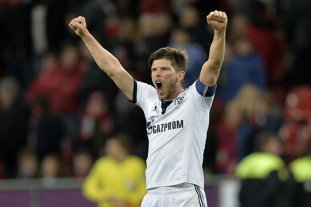 Schalke's Klaas-Jan Huntelaar of the Netherlands celebrates after winning the German Bundesliga soccer match between Bayer Leverkusen and FC Schalke 04 in Leverkusen,  Germany, Saturday, Feb. 15, 2014. Leverkusen was defeated by Schalke with 1-2, Huntelaar scored the decisive goal.  (AP Photo/Martin Meissner)