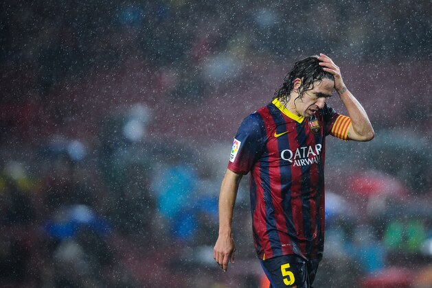 BARCELONA, SPAIN - JANUARY 29:  Carles Puyol of FC Barcelona reacts during the Copa del Rey Quarter Final 2nd leg match between FC Barcelona and Levante U.D Camp Nou on January 29, 2014 in Barcelona, Spain.  (Photo by David Ramos/Getty Images)