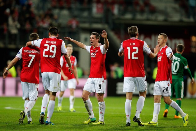 ALKMAAR, NETHERLANDS - NOVEMBER 28:  Johann Berg Gudmundsson (#7) of AZ is congratulated by team mates after he shoots and scores the second goal of the ganme during the UEFA Europa League Group L match between AZ Alkmaar and Maccabi Haifa FC at the AFAS Stadium on November 28, 2013 in Alkmaar, Netherlands.  (Photo by Dean Mouhtaropoulos/Getty Images)