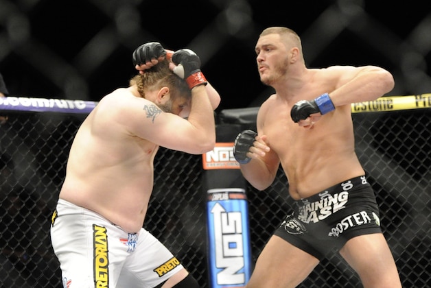 Dec 15, 2012; Las Vegas, NV, USA; Roy Nelson (left) is punched by Matt Mitrione (right) during their heavyweight bout in the Ultimate Fighter Finale at The Joint at the Hard Rock Hotel and Casino. Nelson won by KO. Mandatory Credit: Josh Holmberg-USA TODAY Sports Dec 15, 2012; Las Vegas, NV, USA; Roy Nelson (left) is punched by Matt Mitrione (right) during their heavyweight bout in the Ultimate Fighter Finale at The Joint at the Hard Rock Hotel and Casino. Nelson won by KO. Mandatory Credit: Josh Holmberg-USA TODAY Sports