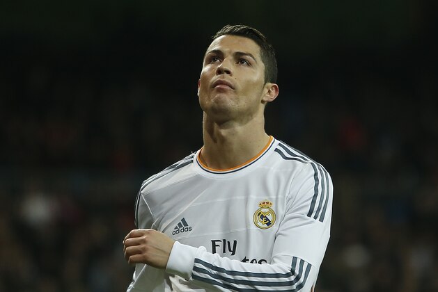 Real Madrid's Cristiano Ronaldo from Portugal gestures after missing a chance during a Copa del Rey soccer match between Real Madrid and Espanyol at the Santiago Bernabeu stadium in Madrid, Spain, Tuesday, Jan. 28, 2014. (AP Photo/Andres Kudacki)