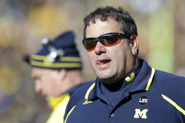 Michigan head coach Brady Hoke looks on during the first half of an NCAA college football game against Iowa, Saturday, Nov. 23, 2013, in Iowa City, Iowa. (AP Photo/Charlie Neibergall) Michigan head coach Brady Hoke looks on during the first half of an NCAA college football game against Iowa, Saturday, Nov. 23, 2013, in Iowa City, Iowa. (AP Photo/Charlie Neibergall)