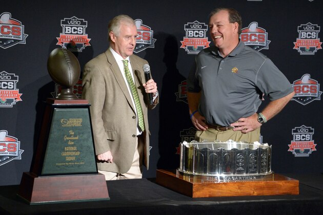 Jan 7, 2014; Newport Beach, CA, USA; Florida State Seminoles coach Jimbo Fisher (right) is presented the Grantland Rice trophy by Football Writers Association president and Austin-American Statesman columnist Kirk Bohls at 2014 BCS National Championship press conference at Newport Beach Marriott. Mandatory Credit: Kirby Lee-USA TODAY Sports