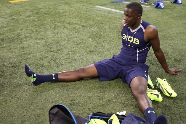 Feb 23, 2014; Indianapolis, IN, USA; Louisville Cardinals quarterback  Teddy Bridgewater stretches prior to work out during the 2014 NFL Combine at Lucas Oil Stadium. Mandatory Credit: Brian Spurlock-USA TODAY Sports