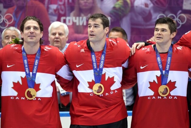 SOCHI, RUSSIA - FEBRUARY 23:  Gold medalists Patrick Sharp #10, Patrick Marleau #12 and Chris Kunitz #14 of Canada celebrate during the medal ceremony after defeating Sweden 3-0 during the Men's Ice Hockey Gold Medal match on Day 16 of the 2014 Sochi Winter Olympics at Bolshoy Ice Dome on February 23, 2014 in Sochi, Russia.  (Photo by Bruce Bennett/Getty Images)