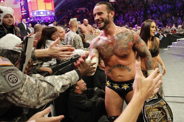 COMMERCIAL  IMAGE - In this photograph taken by AP Images for WWE, WWE Champion CM Punk thanks the troops for their service during WWE’s 9th annual