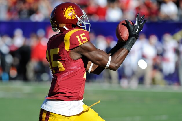 Southern California wide receiver Nelson Agholor (15) makes a touchdown reception against Fresno State in the first quarter of the Royal Purple Bowl NCAA college football game, Saturday, Dec. 21, 2013 in Las Vegas. (AP Photo/David Cleveland)