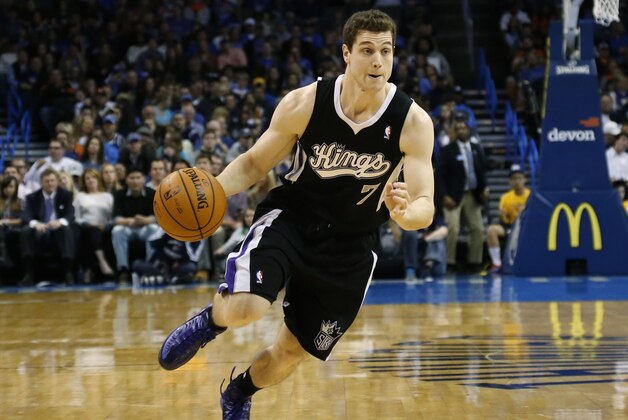 Sacramento Kings guard Jimmer Fredette (7) drives during an NBA basketball game against the Oklahoma City Thunder in Oklahoma City, Sunday, Jan. 19, 2014. Oklahoma City won 108-93.(AP Photo/Sue Ogrocki)
