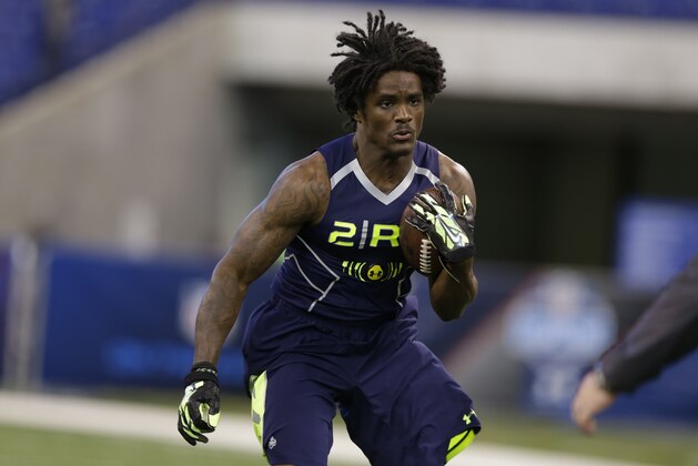 Kent State running back Dri Archer runs a drill at the NFL football scouting combine in Indianapolis, Sunday, Feb. 23, 2014. (AP Photo/Michael Conroy)