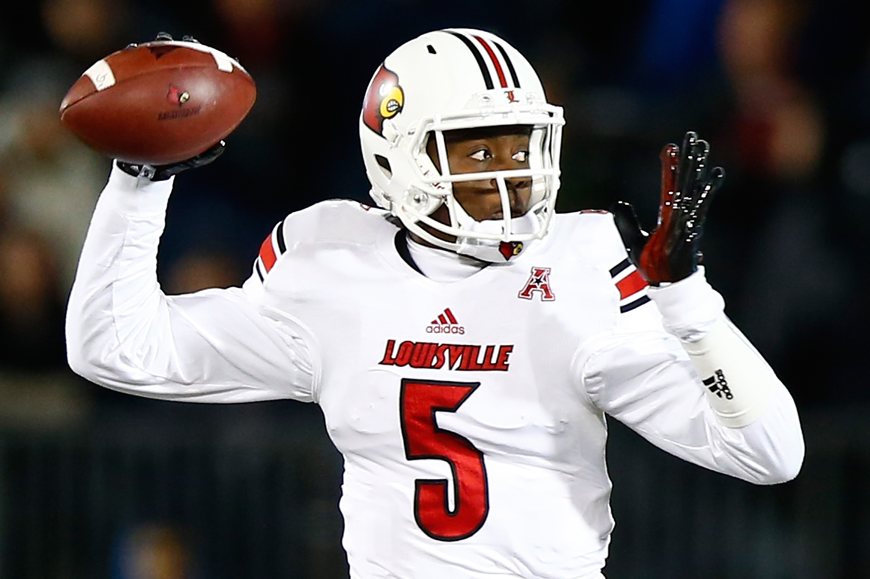 EAST HARTFORD, CT - NOVEMBER 08:  Teddy Bridgewater #5 of the Louisville Cardinals drops back to throw a pass against the Connecticut Huskies at Rentschler Field in the first quarter during the game on November 8, 2013 in East Hartford, Connecticut.  (Photo by Jared Wickerham/Getty Images)