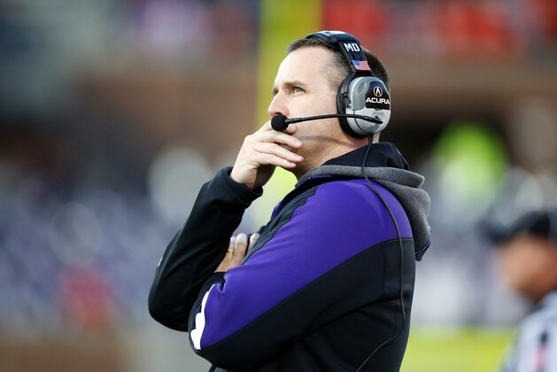 Northwestern head coach Pat Fitzgerald looks at the scoreboard during an NCAA college football game on Saturday, Nov. 30, 2013, against Illinois in Champaign, Ill. (AP Photo/Jeff Haynes)