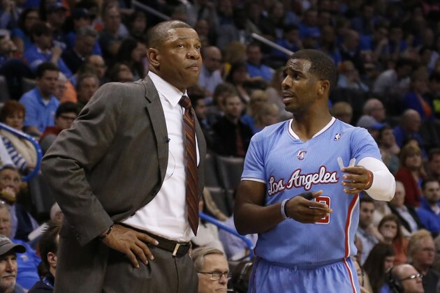 Los Angeles Clippers head coach Doc Rivers talks with guard Chris Paul (3) during an NBA basketball game between the Los Angeles Clippers and the Oklahoma City Thunder in Oklahoma City, Sunday, Feb. 23, 2014. Los Angeles won 125-117. (AP Photo/Sue Ogrocki)