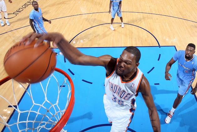 OKLAHOMA CITY, OK - FEBRUARY 23: Kevin Durant #35 of the Oklahoma City Thunder goes up for the dunk against the Los Angeles Clippers during an NBA game on February 23, 2014 at the Chesapeake Energy Arena in Oklahoma City, Oklahoma. NOTE TO USER: User expressly acknowledges and agrees that, by downloading and or using this Photograph, user is consenting to the terms and conditions of the Getty Images License Agreement. Mandatory Copyright Notice: Copyright 2014 NBAE (Photo by Layne Murdoch/NBAE via Getty Images)