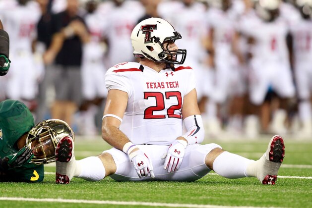 Nov 16, 2013; Arlington, TX, USA;  Texas Tech Red Raiders tight end Jace Amaro (22) sits on the field during the game against the Baylor Bears at AT&T Stadium. Baylor beat Texas Tech 63-34. Mandatory Credit: Tim Heitman-USA TODAY Sports