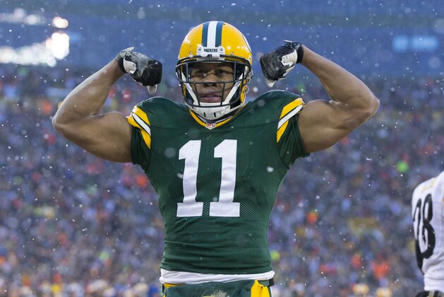 Dec 22, 2013; Green Bay, WI, USA; Green Bay Packers wide receiver Jarrett Boykin (11) celebrates a touchdown catch during the first quarter against the Pittsburgh Steelers at Lambeau Field. Mandatory Credit: Jeff Hanisch-USA TODAY Sports