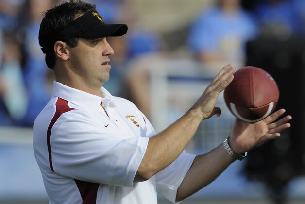 Southern California's assistant coach Steve Sarkisian watches the team warm up before their NCAA college football game against UCLA at the Rose Bowl in Pasadena, Calif., Saturday, Dec. 6, 2008.  (AP Photo/Chris Carlson)