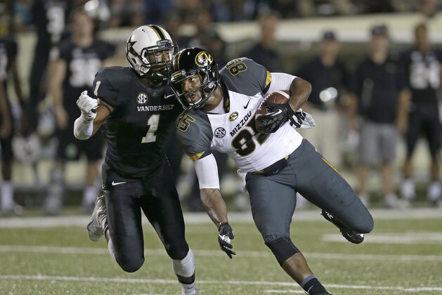 Missouri wide receiver Marcus Lucas (85) is brought down by Vanderbilt safety Kenny Ladler (1) in the first quarter of an NCAA college football game Saturday, Oct. 5, 2013, in Nashville, Tenn. (AP Photo/Mark Humphrey)