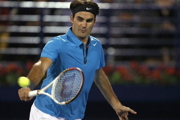 Roger Federer of Switzerland returns to Tomas Berdych of Czech Republic during the semi-finals of the Dubai Duty Free Tennis Championships in Dubai, United Arab Emirates, Monday, March 1, 2013. (AP Photo/Regi Varghese)