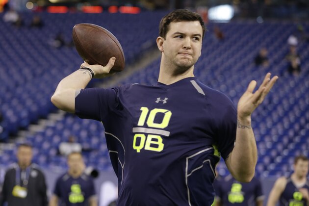 Alabama quarterback AJ McCarron throws during a drill at the NFL football scouting combine in Indianapolis, Sunday, Feb. 23, 2014. (AP Photo/Michael Conroy)