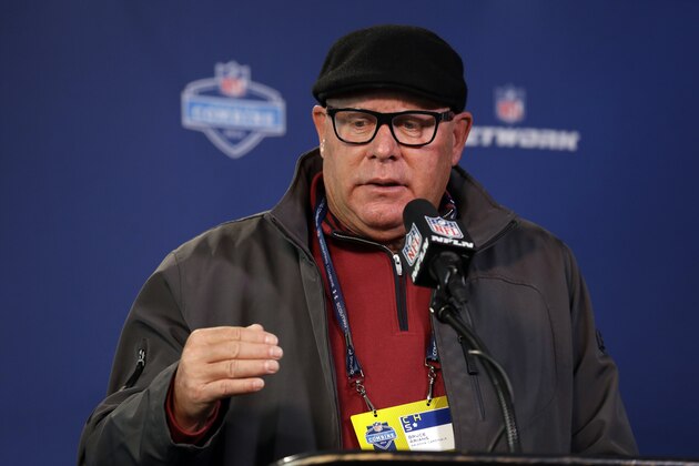 Arizona Cardinals head coach Bruce Arians answers a question during a news conference at the NFL football scouting combine in Indianapolis, Friday, Feb. 21, 2014. (AP Photo/Michael Conroy)