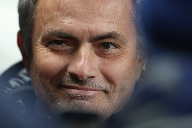 Chelsea's manager Jose Mourinho smiles as he waits for the English Premier League soccer match between Manchester City and Chelsea at the Etihad Stadium, Manchester, England, Monday, Feb. 3, 2014. (AP Photo/Jon Super)