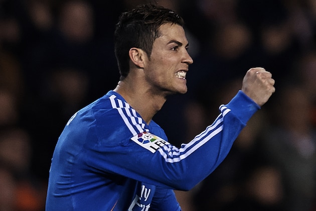VALENCIA, SPAIN - DECEMBER 22:  Cristiano Ronaldo of Real Madrid celebrates after scoring during the La Liga match between Valencia CF and Real Madrid CF at Estadio Mestalla on December 22, 2013 in Valencia, Spain.  (Photo by Manuel Queimadelos Alonso/Getty Images)