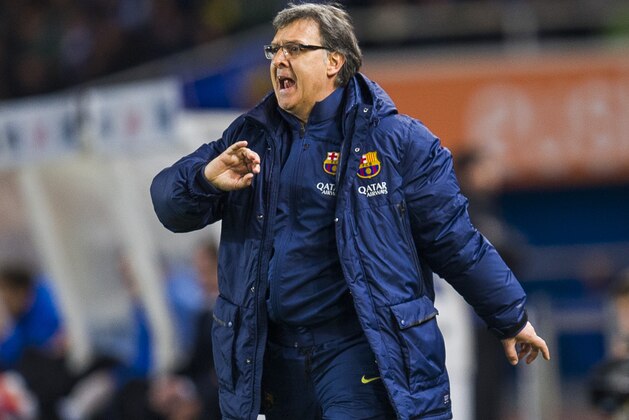 SAN SEBASTIAN, SPAIN - FEBRUARY 12:  Head coach Gerardo Tata Martino of FC Barcelona reacts during the Copa del Rey Semi-Final first leg match betweenReal Sociedad and Barcelona at Estadio Anoeta  on February 12, 2014 in San Sebastian, Spain.  (Photo by Juan Manuel Serrano Arce/Getty Images)