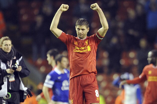 Liverpool's Steven Gerrard celebrates his side's victory at the end of the game during their English Premier League soccer match against Everton at Anfield in Liverpool, England, Tuesday Jan. 28, 2014. (AP Photo/Clint Hughes)