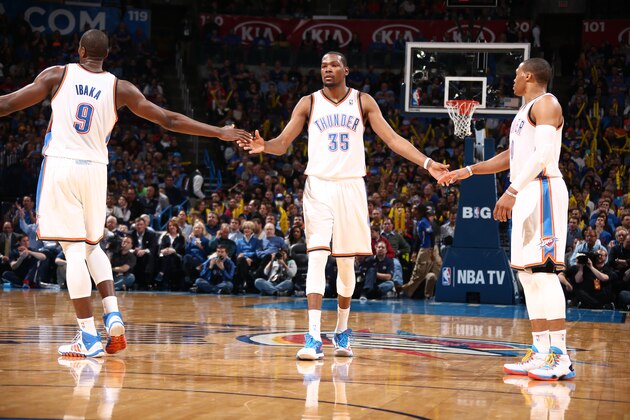 OKLAHOMA CITY, OK - FEBRUARY 23: Kevin Durant #35 of the Oklahoma City Thunder, Russell Westbrook #0 of the Oklahoma City Thunder, and Serge Ibaka #9 of the Oklahoma City Thunder react during a game at Chesapeake Energy Arena on February 23, 2014 in Oklahoma City, Oklahoma. NOTE TO USER: User expressly acknowledges and agrees that, by downloading and/or using this photograph, user is consenting to the terms and conditions of the Getty Images License Agreement.  Mandatory Copyright Notice: Copyright 2014 NBAE (Photo by Nathaniel S. Butler/NBAE via Getty Images)