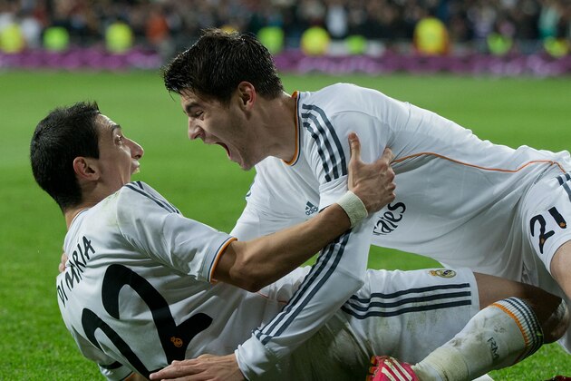 MADRID, SPAIN - FEBRUARY 05:  Angel Di Maria (L) of Real Madrid CF celebrates scoring their third goal with teammate Alvaro B. Morata during the Copa del Rey semifinal first leg match between Real Madrid CF and Club Atletico Madrid at Estadio Santiago Bernabeu on February 5, 2014 in Madrid, Spain.  (Photo by Gonzalo Arroyo Moreno/Getty Images)