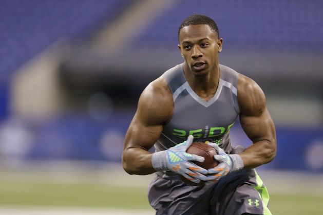 Oklahoma State defensive back Justin Gilbert runs a drill at the NFL football scouting combine in Indianapolis, Tuesday, Feb. 25, 2014. (AP Photo/Michael Conroy)