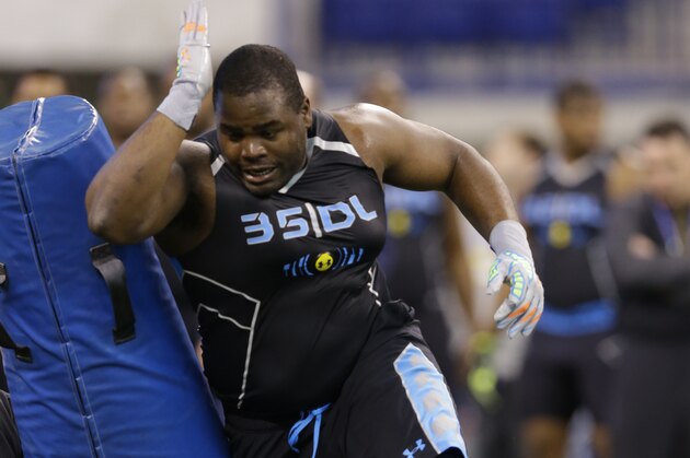 Notre Dame defensive lineman Louis Nix runs a drill at the NFL football scouting combine in Indianapolis, Monday, Feb. 24, 2014. (AP Photo/Michael Conroy)