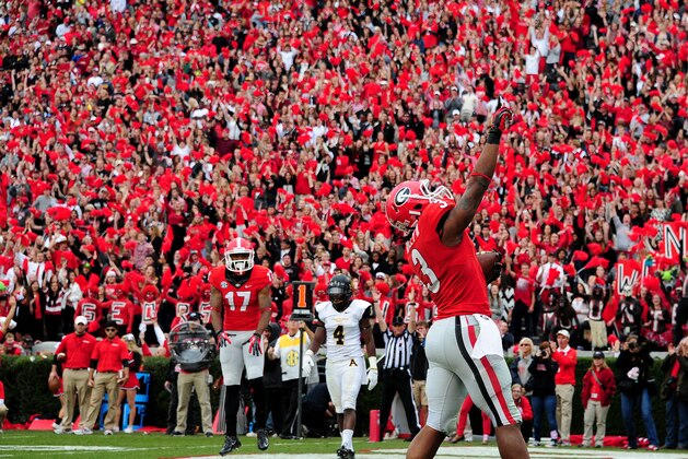 ATHENS, GA - NOVEMBER 9: Todd Gurley #3 of the Georgia Bulldogs celebrates after scoring a touchdown against the Appalachian State Mountaineers at Sanford Stadium on November 9, 2013 in Athens, Georgia. (Photo by Scott Cunningham/Getty Images)