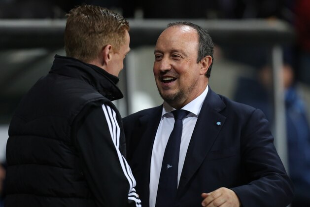Napoli coach Rafael Benitez, right, greets Swansea's manager Garry Monk before their Europa League round of 32 first leg soccer match at the Liberty Stadium, Swansea, Wales, Thursday Feb. 20, 2014. (AP Photo/Jon Super)