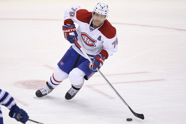 Jan 18, 2014; Toronto, Ontario, CAN; Montreal Canadiens defenseman Andrei Markov (79) skates with the puck against the Toronto Maple Leafs at Air Canada Centre. The Maple Leafs beat the Canadiens 5-3. Mandatory Credit: Tom Szczerbowski-USA TODAY Sports