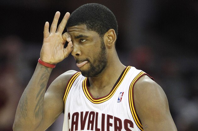 Feb 25, 2014; Cleveland, OH, USA; Cleveland Cavaliers point guard Kyrie Irving (2) after hitting a three-point shot against the Toronto Raptors during the third quarter at Quicken Loans Arena. The Raptors won 99-93. Mandatory Credit: Ron Schwane-USA TODAY Sports