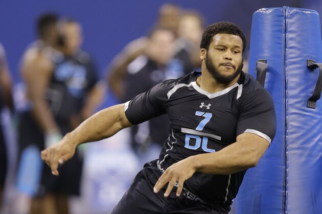 Pittsburgh defensive lineman Aaron Donald runs a drill at the NFL football scouting combine in Indianapolis, Monday, Feb. 24, 2014. (AP Photo/Michael Conroy)