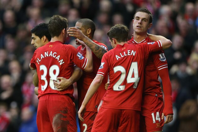 LIVERPOOL, ENGLAND - FEBRUARY 23:  Jordan Henderson of Liverpool celebrates scoring his team's fourth goal with his team-mates during the Barclays Premier League match between Liverpool and Swansea City at Anfield on February 23, 2014 in Liverpool, England.  (Photo by Clive Brunskill/Getty Images)