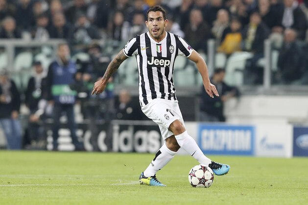 Juventus forward Carlos Tevez, of Argentina, controls the ball during a Champions League, Group B, soccer match between Juventus and Real Madrid at the Juventus stadium in Turin, Italy, Tuesday, Nov. 5, 2013. (AP Photo/Antonio Calanni)