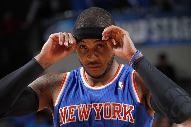 DALLAS, TX - JANUARY 5:  Carmelo Anthony #7 of the New York Knicks walks off the court against the Dallas Mavericks on January 5, 2014 at the American Airlines Center in Dallas, Texas. NOTE TO USER: User expressly acknowledges and agrees that, by downloading and or using this photograph, User is consenting to the terms and conditions of the Getty Images License Agreement. Mandatory Copyright Notice: Copyright 2014 NBAE (Photo by Glenn James/NBAE via Getty Images)