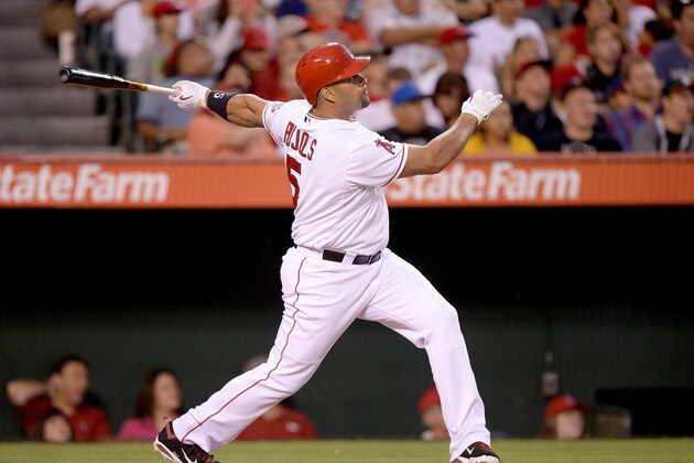 ANAHEIM, CA - JULY 19:  Albert Pujols #5 of the Los Angeles Angels hits a solo homerun to take a 2-0 lead over the Oakland Athletics during the third inning at Angel Stadium of Anaheim on July 19, 2013 in Anaheim, California.  (Photo by Harry How/Getty Images)