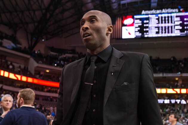 Jan 7, 2014; Dallas, TX, USA; Los Angeles Lakers shooting guard Kobe Bryant (24) comes off the court after the game against the Dallas Mavericks at the American Airlines Center. The Mavericks defeated the Lakers 110-97. Mandatory Credit: Jerome Miron-USA TODAY Sports